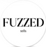 Circular logo with 'FUZZED' text on a black and white background